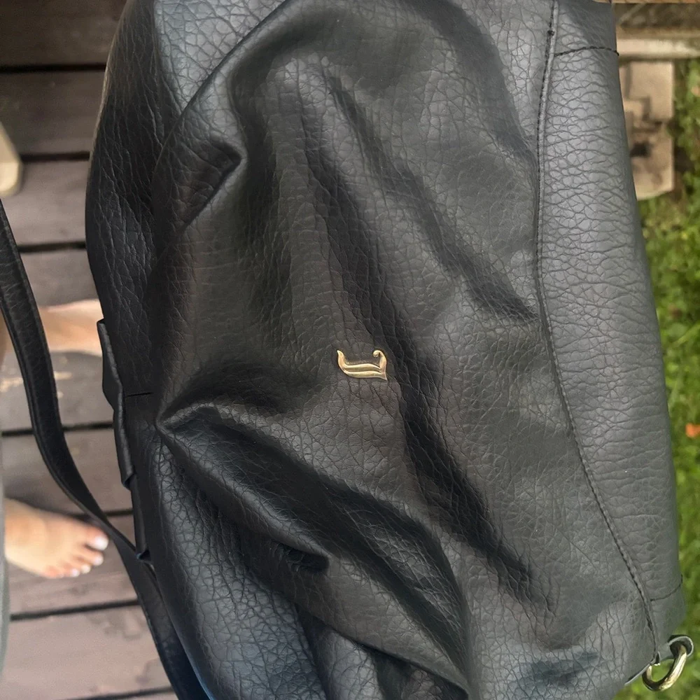 Y2K Juicy Couture Black Hobo Bag with Gold Chain Accents.